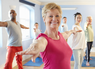 A group of people taking an exercise class